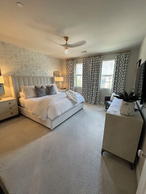 Primary Bedroom with king adjustable bed and luxury linens