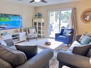 Large 65” TV with Roku for streaming and ample seating for guests.