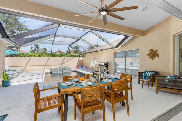 Large covered patio area. The lanai is fully screened. Heated pool and jacuzzi spa. Gas grill.
