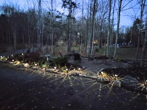 View of front yard from front porch at dusk
