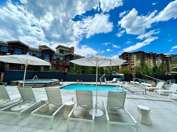 Mountains welcome you. The relaxing pool and hot tub are open year-round.