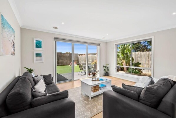 Plenty of seating for everyone to relax and enjoy family time together. Direct flow to the alfresco space and backyard