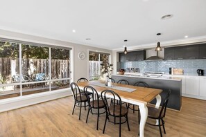 Overlooking the dining and living area, the kitchen allows for easy meal prep while staying connected with the family