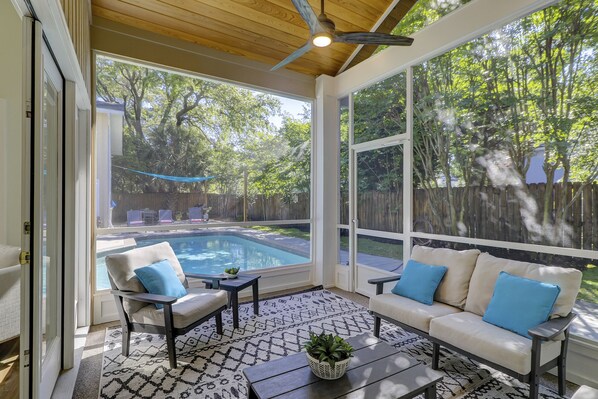 Large screened in porch is part of the outdoor living space.