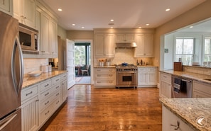 Gourmet kitchen with access to dining porch