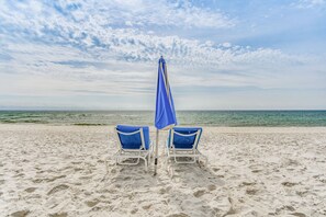 Enjoy the Beach Club's chairs and umbrellas and chill by the Gulf! 