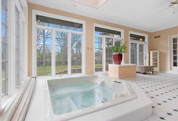 Awesome large room right off the kitchen and living room with built-in five-person hot tub.