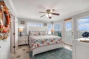 Primary bedroom with private balcony overlooking the gulf.
