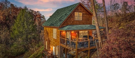 Nestled against the mountain side, private decks, hot tub, and more