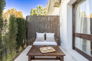 Charming terrace equipped with outdoor furniture, ideal to enjoy a peaceful rest. (1)