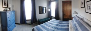 Comfortable bedroom stocked with extra blankets and pillows.