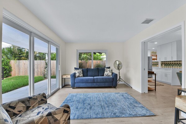 Sitting room with desk, patio doors to garden