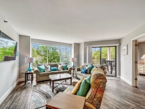 Living Room with Balcony Access and Flat Screen TV at 3228 Villamare