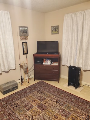 32" TV, DVD player, fishing equipment