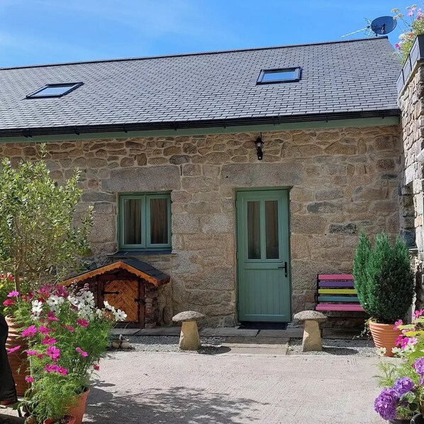 Rear entrance and patio with seating area