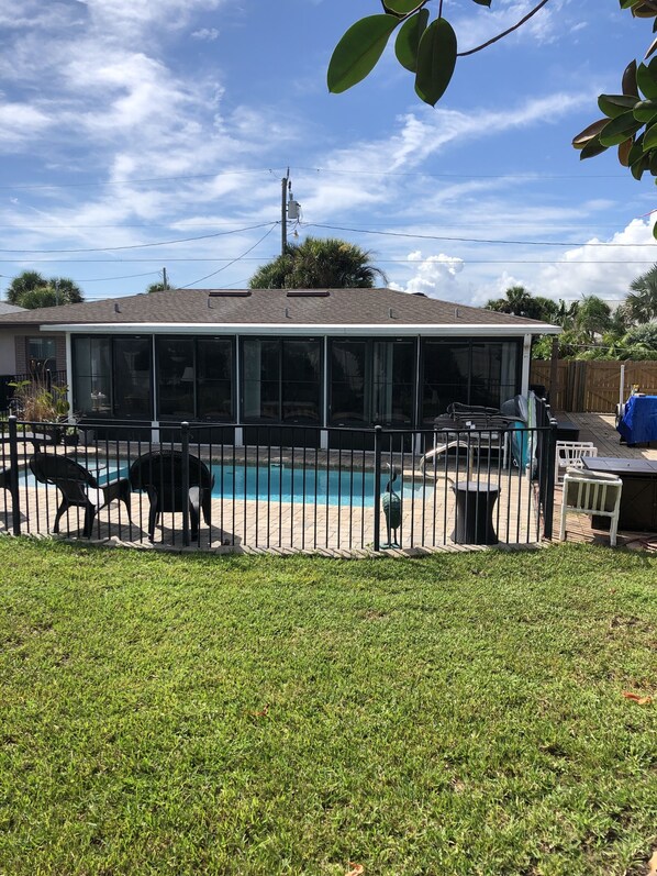 Big Spacious backyard fenced in and a safety fence around pool with lock
