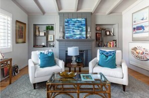 Living room featuring a record player and an eclectic mix of vinyl to set any mood!