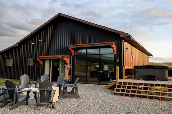 Front entrance. Outside seating area with gas fire pit, deck with hot tub overlooking the valley. 