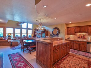 The spacious kitchen with large island to gather round while enjoying meals 