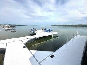 New dock with guest boat slip, 16' x 24' seating area, stairs for water access