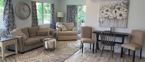 Living Room and Dining Area.  Dining Table folds out for meals or as a desk.