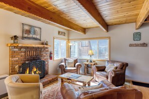 The second living area doubles as a game room and features a large TV.