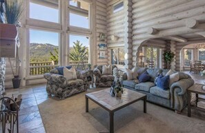 Beautiful living room with floor to ceiling windows.