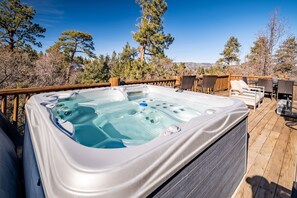 Hot tub with mountain views.