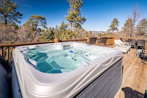 Hot tub with mountain views.
