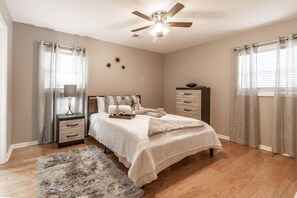 A bright and cozy master bedroom is just perfect for a good night's sleep.