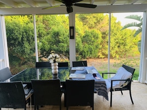Spacious outdoor seating, fully screened in.