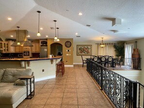 Open floor plan with kitchen/ dining/ family room