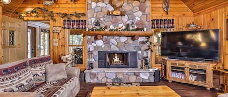 cozy sitting on either side of double sided wood burning fireplace