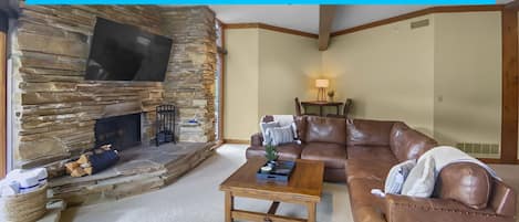 24B Powder Run - a SkyRun Park City Property - Cozy Living Room with Fireplace and Big Screen TV