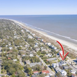 The Penthouse is this close to the beach!