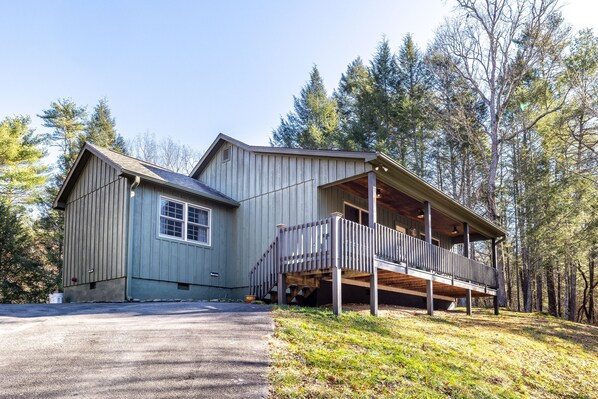 Exterior of cabin with paved parking area