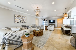 Large Living Area of the Villa in Noord Aruba - Lots of seating - Smart TV and Netflix - Well-chosen lighting fixtures adding both functionality and charm - Smart use of space with multifunctional furniture for a practical yet beautiful environment