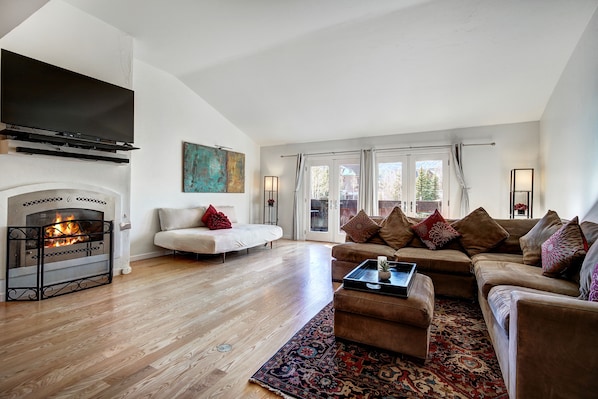 Living room with fireplace large flatscreen TV