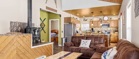 Living Room as you walk-in.  New Couches and PA Live Edge Wood Coffee Table.  