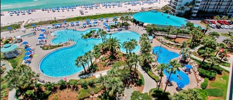 Drone photo of Lagoon pool, Splash Pad, resort restaurant, beach access, etc.