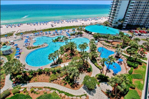 Drone photo of Lagoon pool, Splash Pad, resort restaurant, beach access, etc.