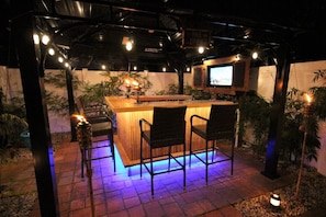 Backyard tiki bar with tv and bluetooth stereo.