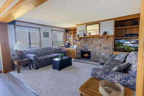 Kick back and relax in the spacious living room and in front of the wood burning fireplace!