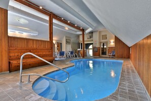 The fitness center features an indoor pool, hot tub, sauna, and a small fitness area