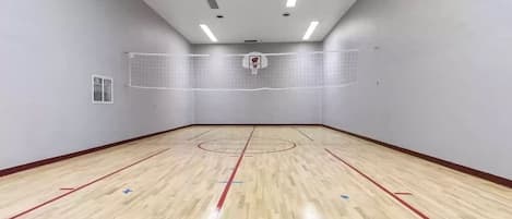 Enjoy your own indoor basketball court/volleyball court.  This room is located just off of the arcade.  