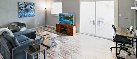 Living room has a desk for working or use as a vanity