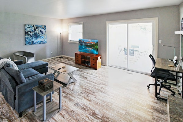 Living room has a desk for working or use as a vanity