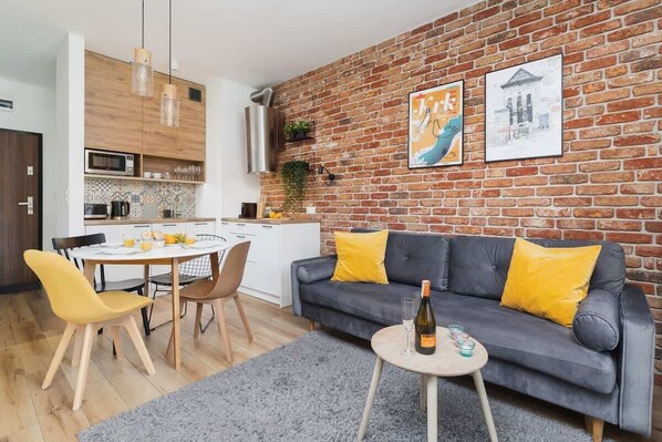 Loft style living room with kitchenette.