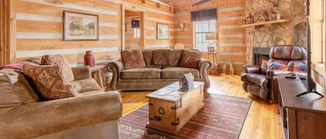 Your den is an authentic log cabin that is warm and cozy