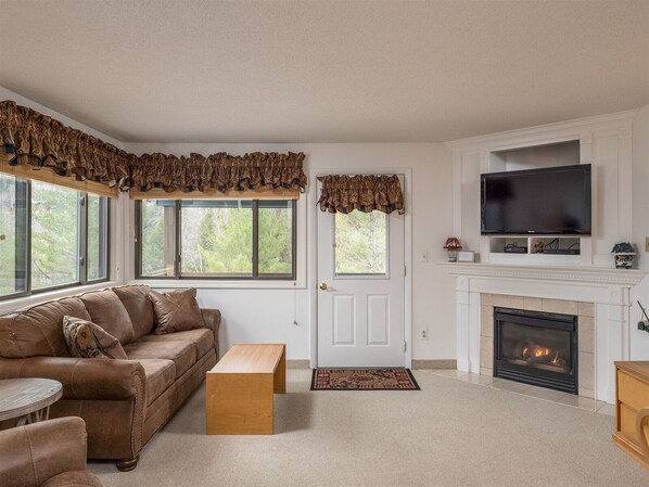 open concept condo with gas fireplace